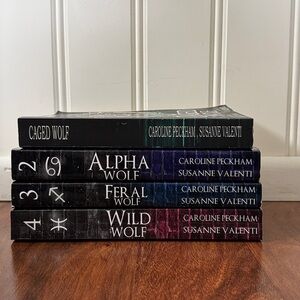 Caged Wolf Series Books 1-4 -- Caroline Peckham & Susanne Valenti